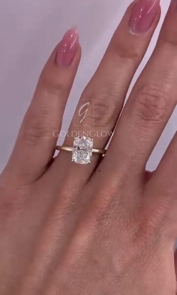 A radiant cut solitaire ring crafted in warm yellow gold, designed to showcase exceptional brilliance from every angle. The elongated radiant diamond is secured in a refined four prong setting that allows light to flood the stone, enhancing sparkle and fire. A smooth polished band offers a clean, modern profile while ensuring comfortable daily wear. Elegant, versatile, and enduring, this ring is perfect as an engagement piece or a signature statement that celebrates understated luxury.